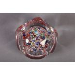 AN ANTIQUE CLICHY PAPERWEIGHT close concentric millefiore with mushroom issuing from a spiral red