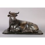 A FINELY CARVED 19TH CENTURY COW, recumbent with rear legs and tail visible, its front legs tucked