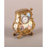A LATE 19TH CENTURY VIENNESE ORMOLU AND ENAMEL CLOCK, in ornate rococo case centred at the base with