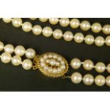 CULTURED PEARL CHOKER NECKLACE in two strands of approximately 7mm pearls fastened with a 9ct gold