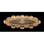 AN EDWARD VII DIAMOND SET BROOCH in 15ct gold, star set to the centre with a transitional