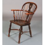 A 19TH CENTURY YEW WOOD LOW BACK WINDSOR ARMCHAIR having a pierced splat and rail back, turned