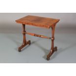 A REGENCY ROSEWOOD VENEERED TABLE, the rectangular figured top above pierced and waisted refectory