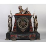 A VICTORIAN EGYPTIAN REVIVAL BLACK SLATE MANTEL CLOCK of architectural form, the case with central