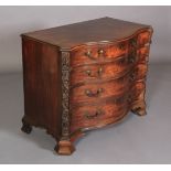 A GEORGE III MAHOGANY SERPENTINE FRONTED COMMODE, having four graduated cockbeaded drawers, gilt