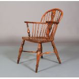 A 19TH CENTURY YEW WOOD LOW BACK WINDSOR ARMCHAIR having a pierced splat and rail back, turned