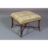 A VICTORIAN ROSEWOOD STOOL, rectangular, upholstered in floral gros point, on barley turned legs