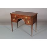 AN EARLY 19TH CENTURY MAHOGANY SIDE TABLE, having a drawer across above an arched apron flanked by a