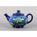 A WILLIAM MOORCROFT TEAPOT OF MOONLIT BLUE LANDSCAPE DESIGN c.1924 impressed mark and blue painted