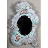 AN ORNATE VENETIAN PRESSED GLASS AND MICRO MOSAIC WALL MIRROR of 'C' and flower scroll form, the