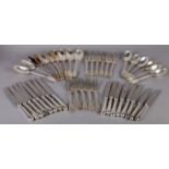 A COMPOSED SUITE OF SILVER FIDDLE PATTERN TABLE CUTLERY comprising: a set of ten table spoons by