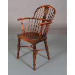 A 19TH CENTURY YEW WOOD LOW BACK WINDSOR ARMCHAIR having a pierced splat and rail back, turned