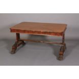 A REGENCY ROSEWOOD LIBRARY TABLE, the apron with petallated rim and fitted with two drawers, on