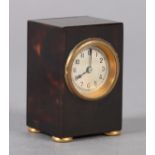 A TORTOISESHELL CASE MINIATURE TRAVEL CLOCK, early 20th century rectangular, with gilt bezel,