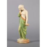 A ROYAL WORCESTER FIGURE OF SORROW, c.1890 in blush ivory and green with gilt highlights, printed