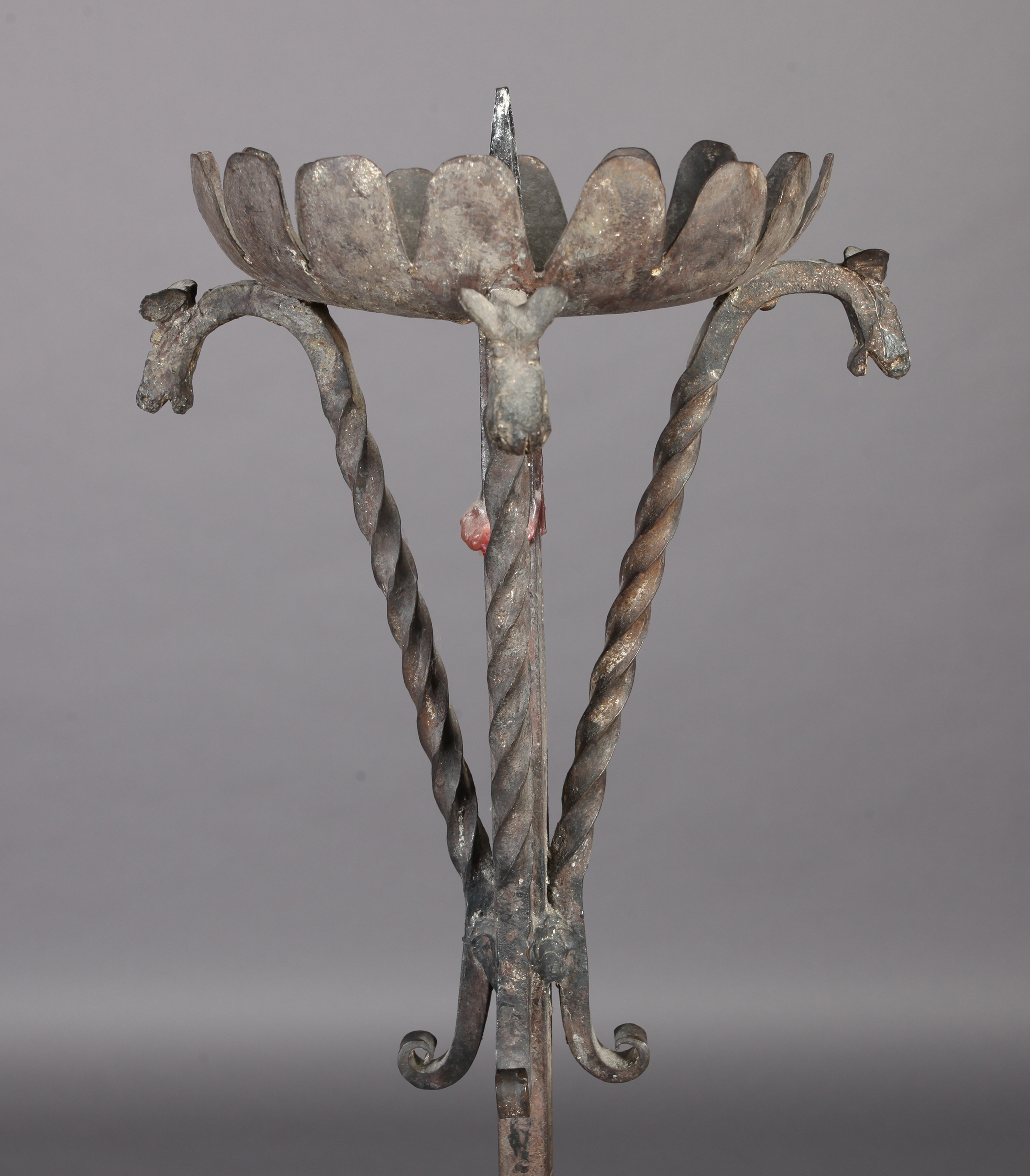 AN ARTS AND CRAFTS WROUGHT IRON CANDLESTAND with broad frilled drip pan supported on four animal - Image 2 of 3