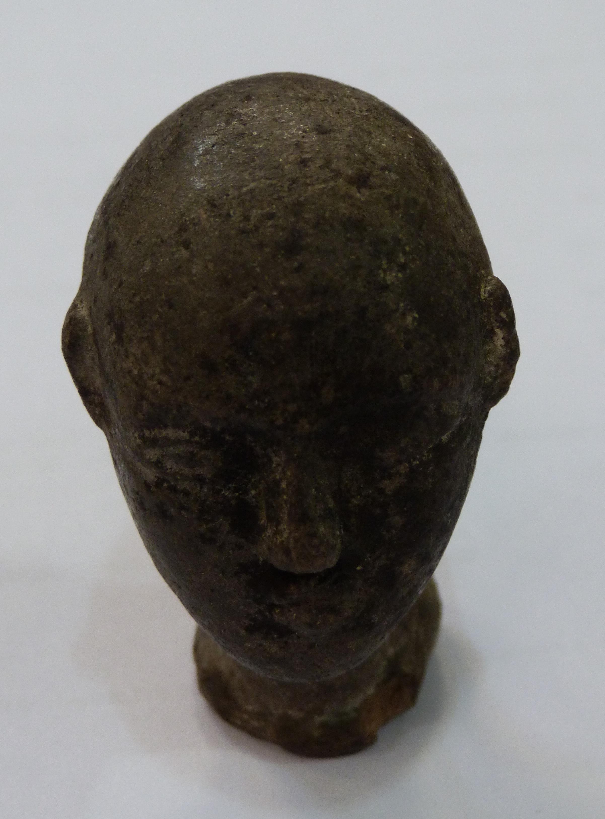 A SMALL POTTERY HEAD realistically modelled with bald pate, shallow oval neck, bearing traces of - Image 2 of 7
