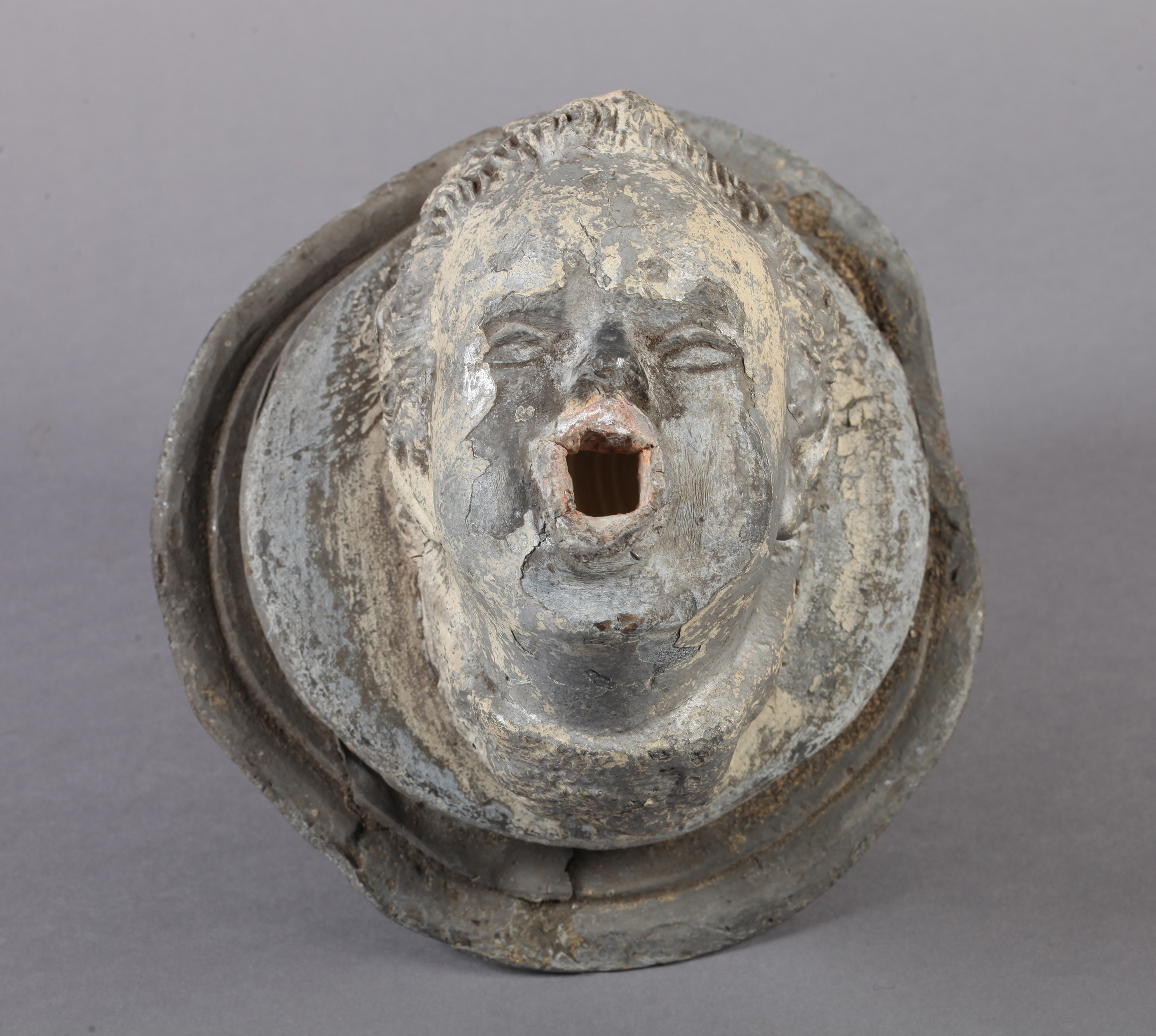 A 19TH CENTURY LEAD CHERUB FACE MASK FOUNTAIN HEAD, with defined features, puffed out cheeks blowing