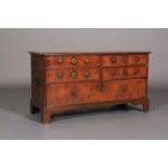 A FIGURED WALNUT AND HERRINGBONE BANDED THREE HEIGHTS CHEST of four short and one deep drawer, brass