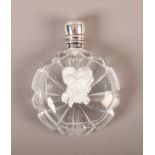A LATE 19TH/EARLY 20TH CENTURY GLASS SCENT BOTTLE of circular flask form, the front with an internal