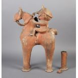 A TERRACOTTA FIGURE OF A RIDER SEATED ON A HORSE, he wears a peaked hat and has a moustache, the