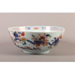 AN 18TH CENTURY CHINESE PORCELAIN FAMILLE ROSE BOWL, circular, the exterior painted with a peony