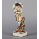 A VICTORIAN CREAMWARE FIGURE OF A SHEPHERD carrying a sheep across his shoulders, rustic stump at