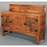 A THOMPSON OF KILBURN 'MOUSEMAN' ENGLISH OAK AND BURR OAK SIDEBOARD, c.1928/1930, adzed, having a