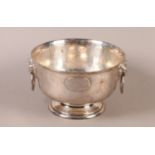A GEORGE V PLANISHED SILVER PUNCH BOWL, circular with twin lion mask and ring handles, on pedestal