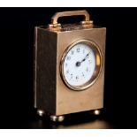 A GEORGE V MINIATURE CLOCK IN 9CT GOLD CASE of rectangular outline, the 30 hour Swiss jewelled
