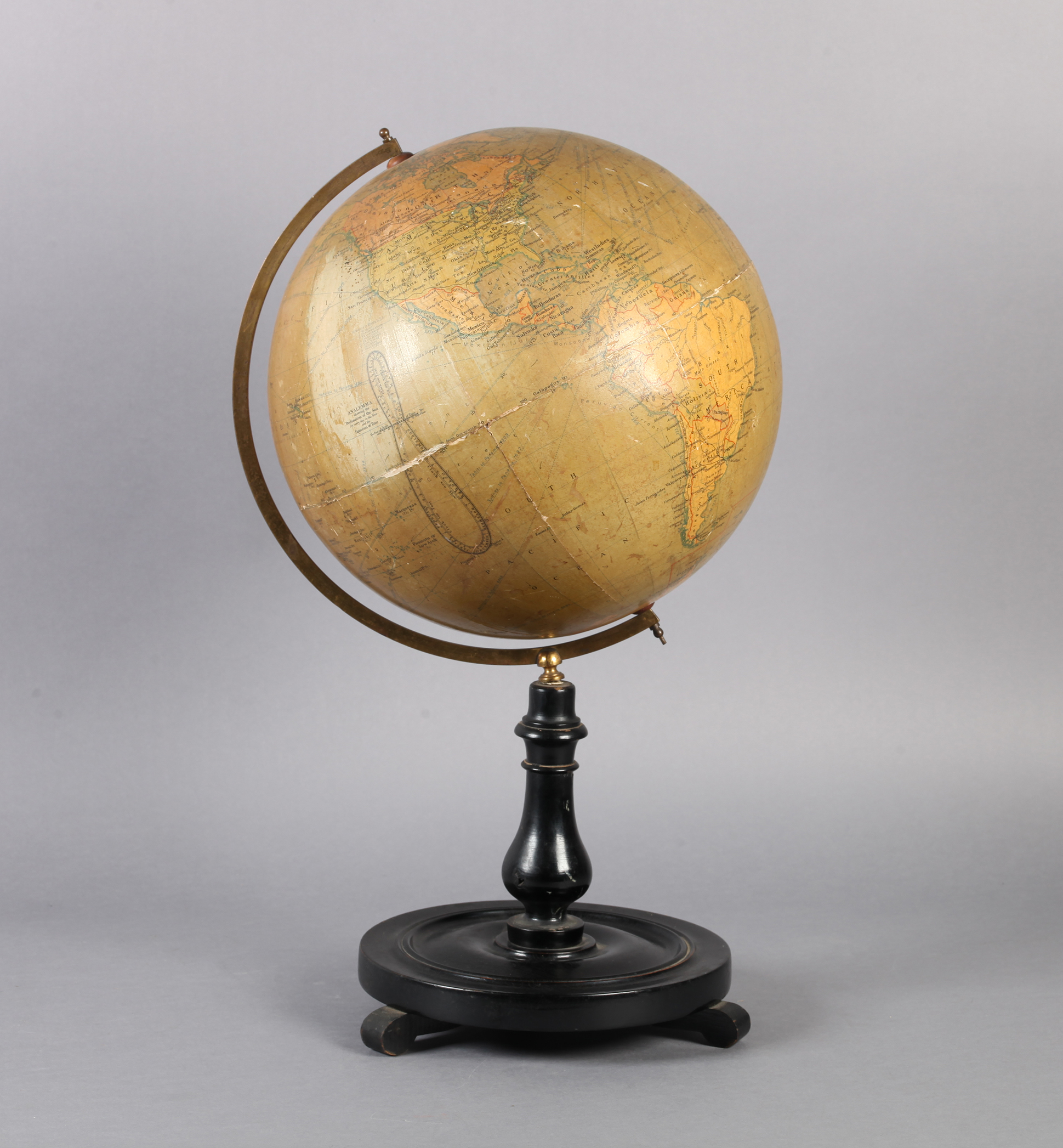 A PHILIPS 12" TERRESTRIAL GLOBE ON STAND, papered plaster globe bearing label inscribed: Principal