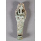 AN EGYPTIAN GLAZED POTTERY USHABTI possibly Osiris with arms crossed, carrying crook and flail,