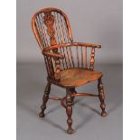 A MID 19TH CENTURY YEW WOOD AND ELM HIGH BACK WINDSOR ARMCHAIR having a pierced splat and rail back,