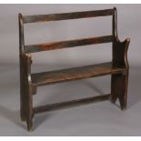 A LATE 18TH CENTURY ELM BENCH having an open back with two horizontal rails, plain seat and swept