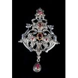 A GARNET AND DIAMOND PENDANT, the pear and oval cabochon garnets collet set within a pierced,