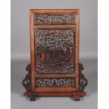 A CHINESE HARDWOOD SCREEN, the rectangular panel with central roundel carved and pierced with