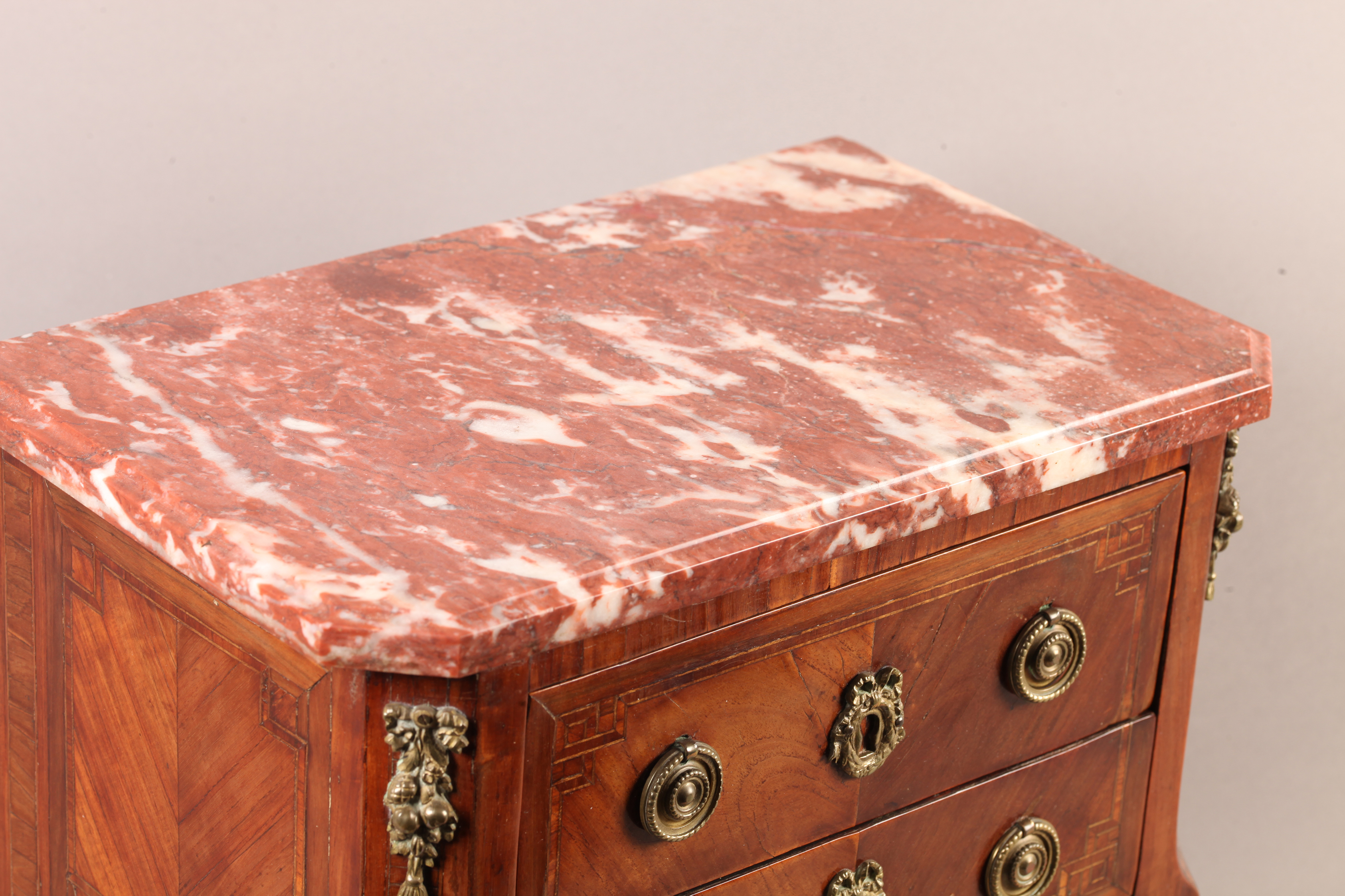 A LOUIS XVI STYLE MINIATURE MAHOGANY VENEERED COMMODE with veined rosso marble moulded top above two - Image 3 of 4