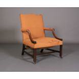 AN 18TH CENTURY MAHOGANY GAINSBOROUGH ARMCHAIR, having a serpentine, upholstered back, arms and