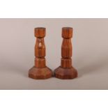 A THOMPSON OF KILBURN 'MOUSEMAN' PAIR OF ENGLISH OAK CANDLESTICKS of octagonal baluster form on