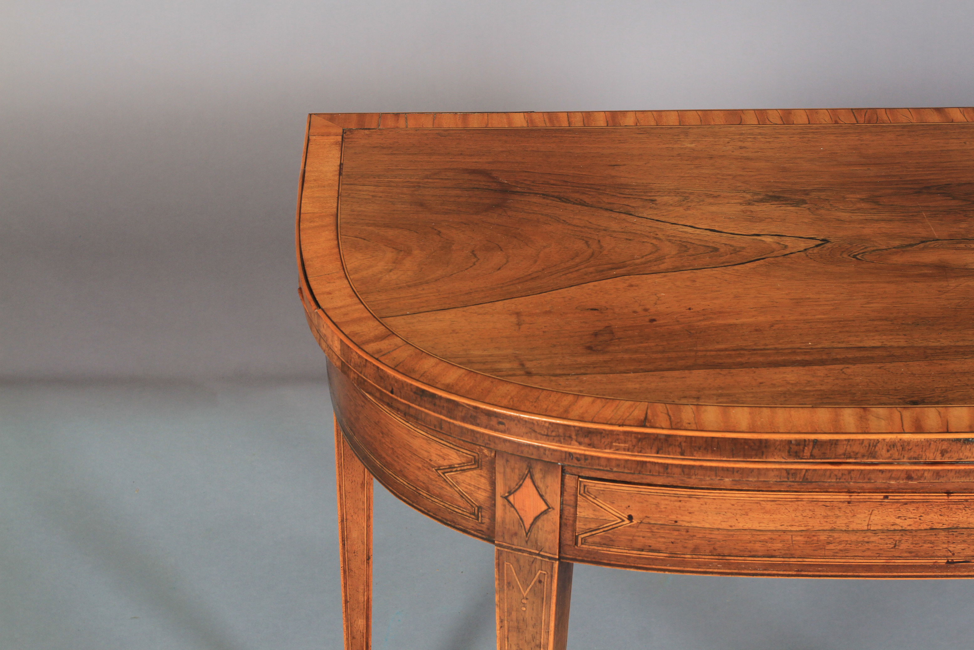 A GEORGE III ROSEWOOD AND SATINWOOD BANDED FOLD-OVER TEA TABLE of 'D' outline, line inlaid with - Image 5 of 6