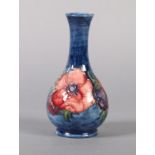 A WILLIAM MOORCROFT ANENOME VASE, tubelined and enamelled in pink-mauve and green on a mid blue