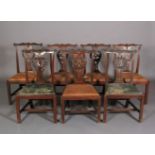 A SET OF SEVEN 18TH CENTURY MAHOGANY DINING CHAIRS, each having a serpentine top rail carved with