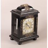 AN EARLY 18TH CENTURY EBONISED BRACKET CLOCK, the case applied with pierced mask and foliate