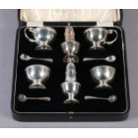 A GEORGE V SILVER SIX PIECE CRUET, BIRMINGHAM 1925 of circular outline with gadroon rims, on
