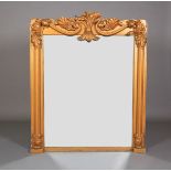 A VICTORIAN GILTWOOD OVERMANTEL MIRROR, having a tied and scrolled foliate cresting, moulded