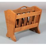 AN ALAN GRAINGER OF BRANDSBY 'ACORN MAN' ENGLISH OAK MAGAZINE RACK of two divisions with railed