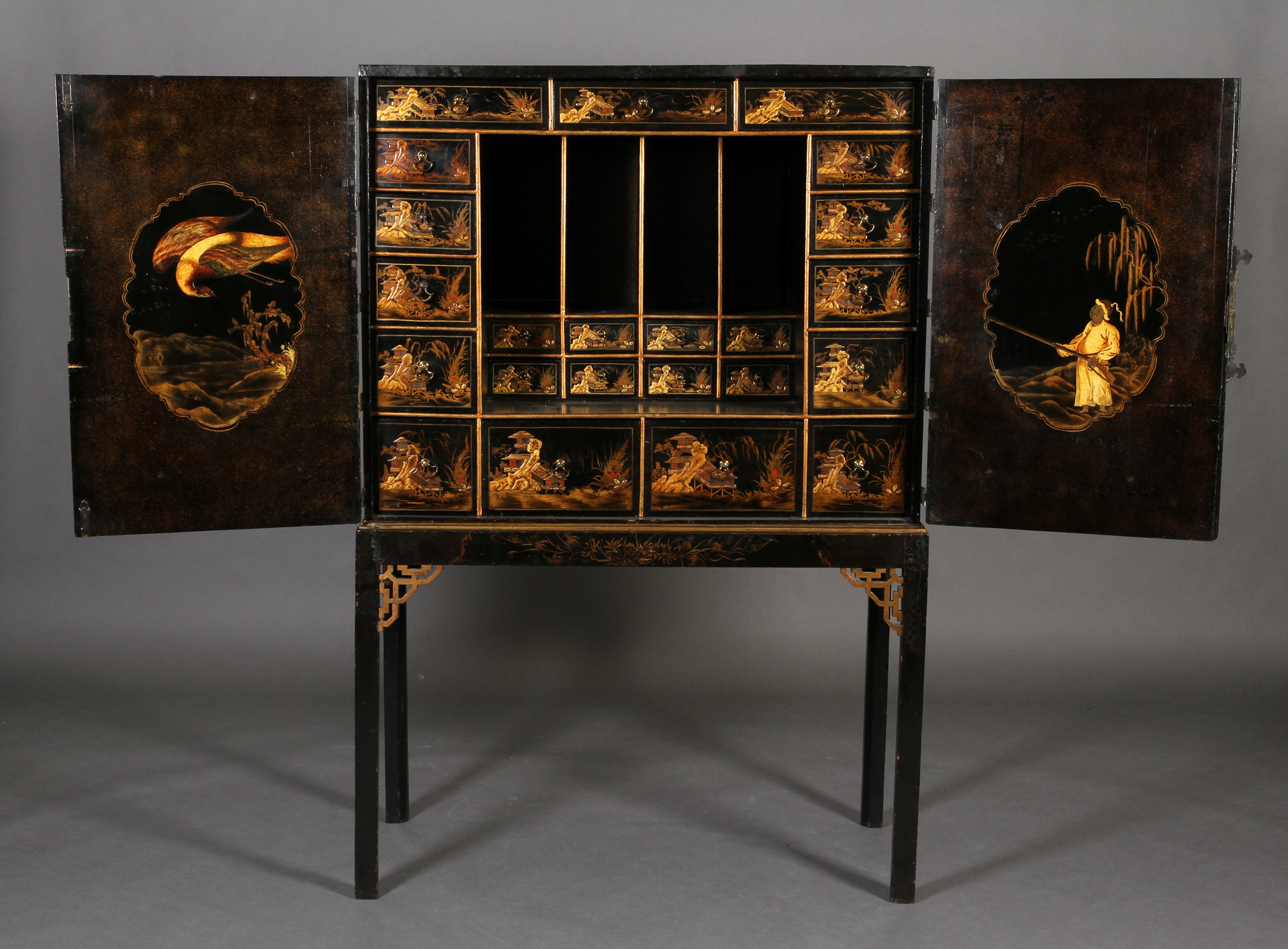 A CHINESE BLACK AND GILT LACQUERED CABINET ON STAND, 19th century, having two doors gilt with - Image 6 of 13