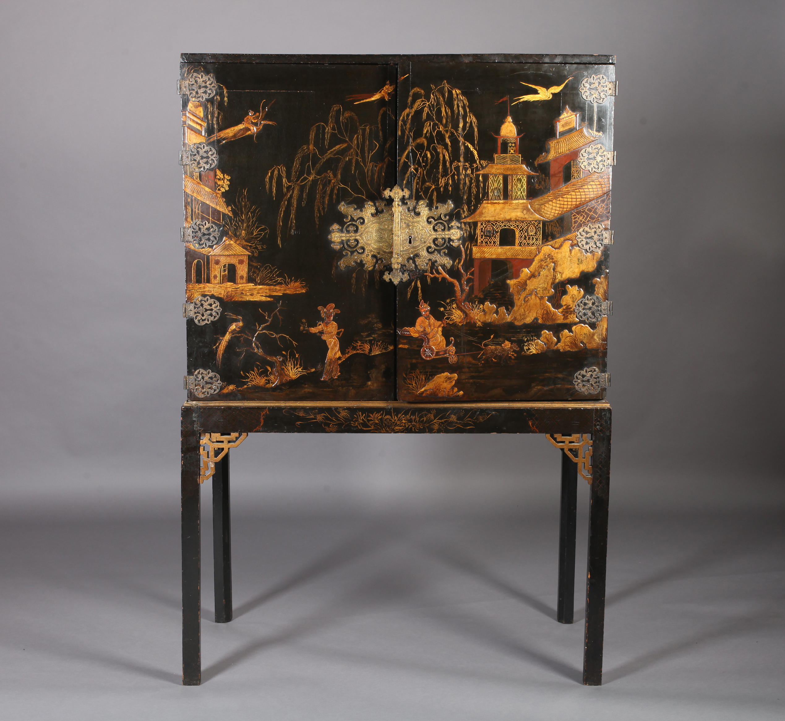 A CHINESE BLACK AND GILT LACQUERED CABINET ON STAND, 19th century, having two doors gilt with - Image 10 of 13