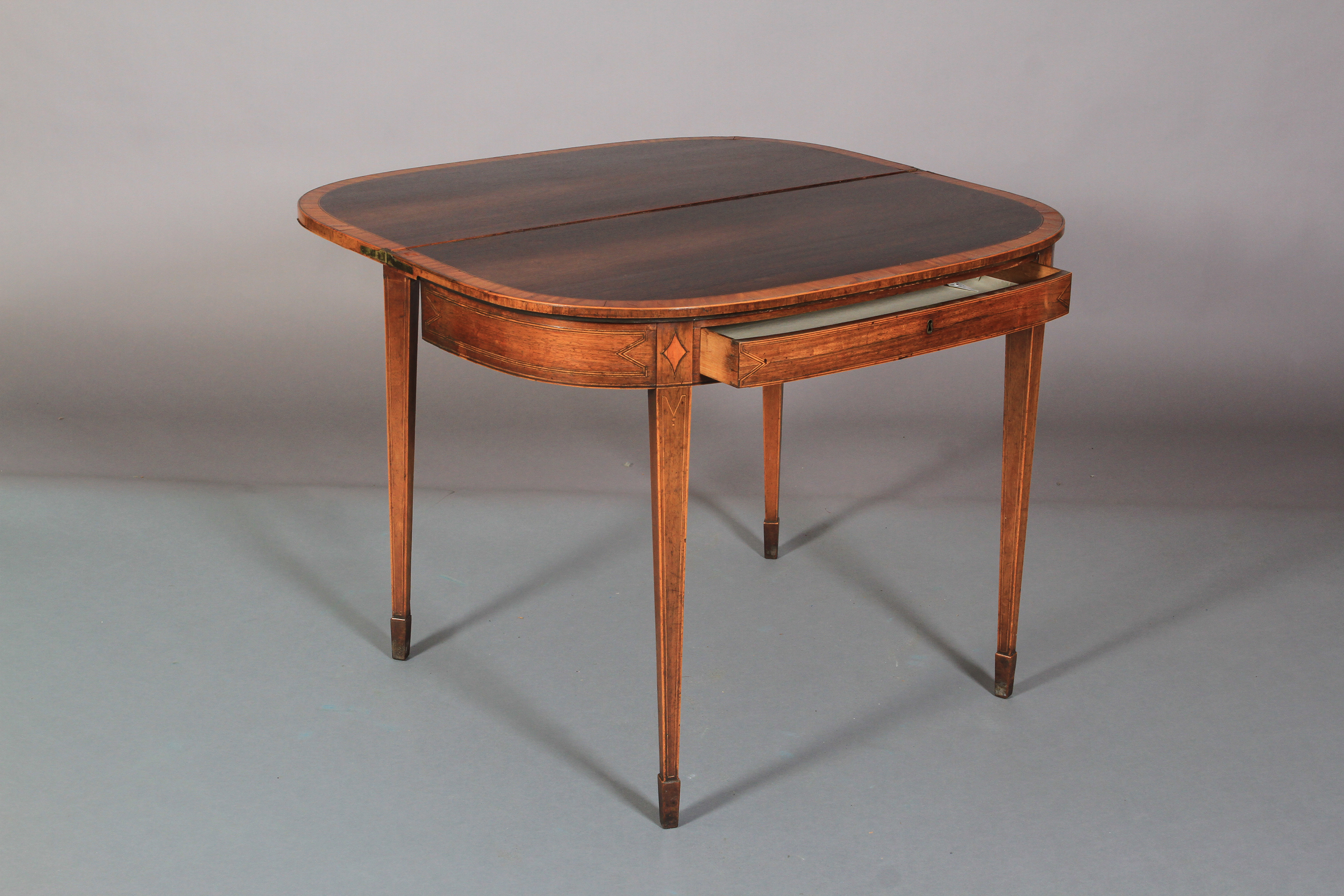 A GEORGE III ROSEWOOD AND SATINWOOD BANDED FOLD-OVER TEA TABLE of 'D' outline, line inlaid with - Image 6 of 6