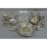 A silver plated ware including bird salt and pepper, pair of inkwells, chamberstick, cruets, glass